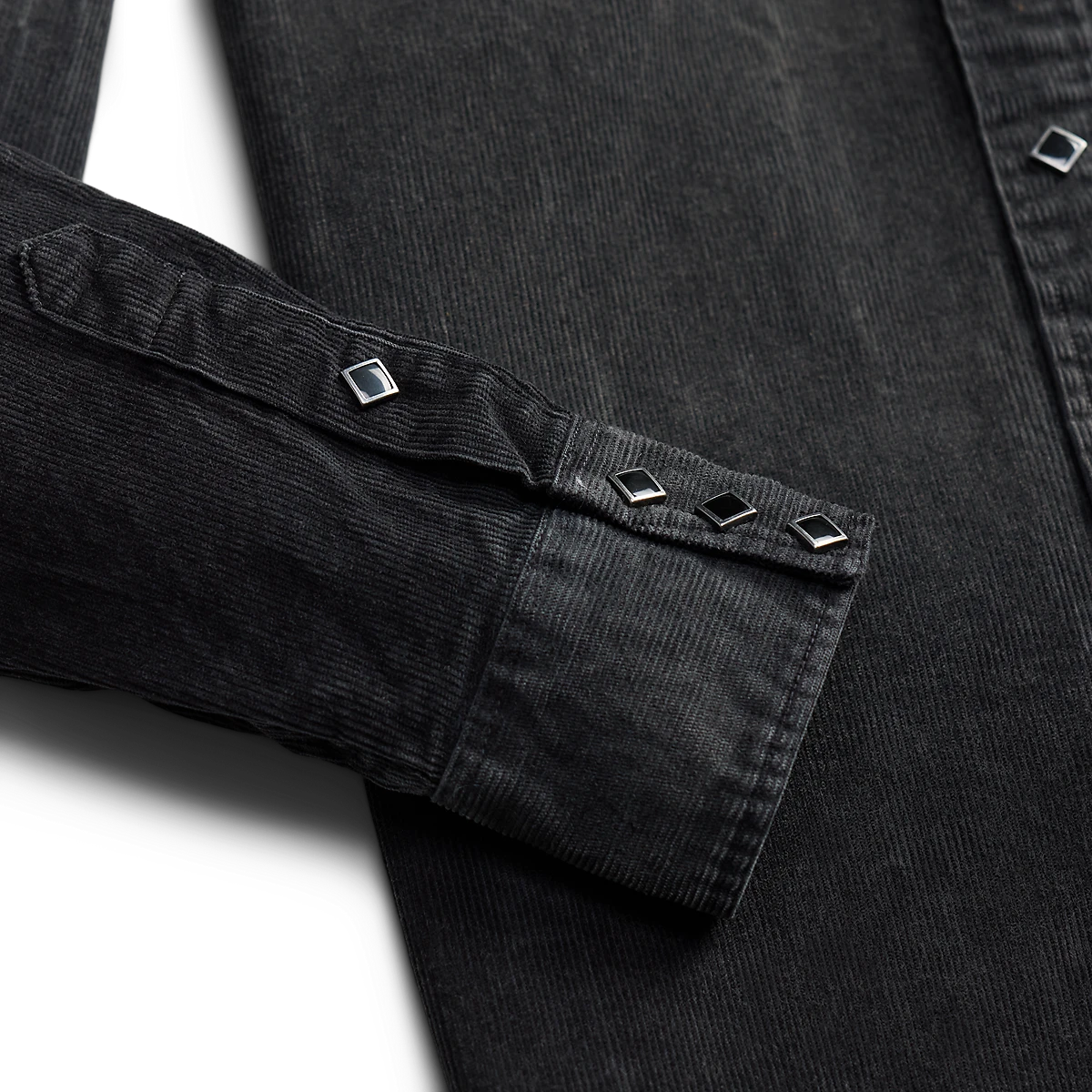 RRL black cotton corduroy western shirt sleeve with diamond-shaped metal snaps and barrel cuffs