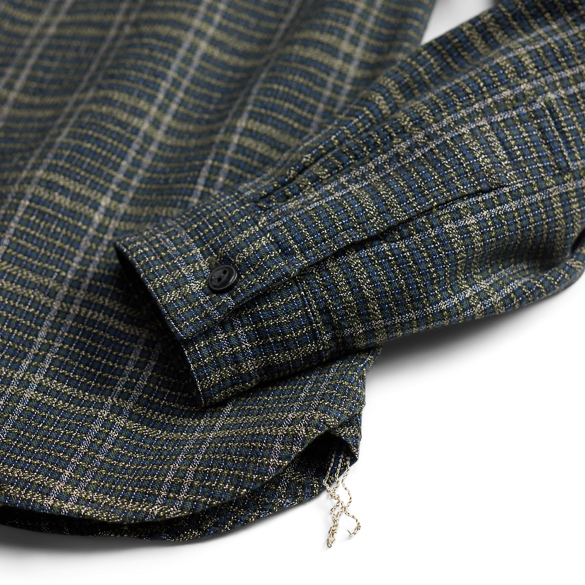 RRL blue and green plaid cotton workshirt sleeve detail with buttoned barrel cuff and chain-stitched side seam