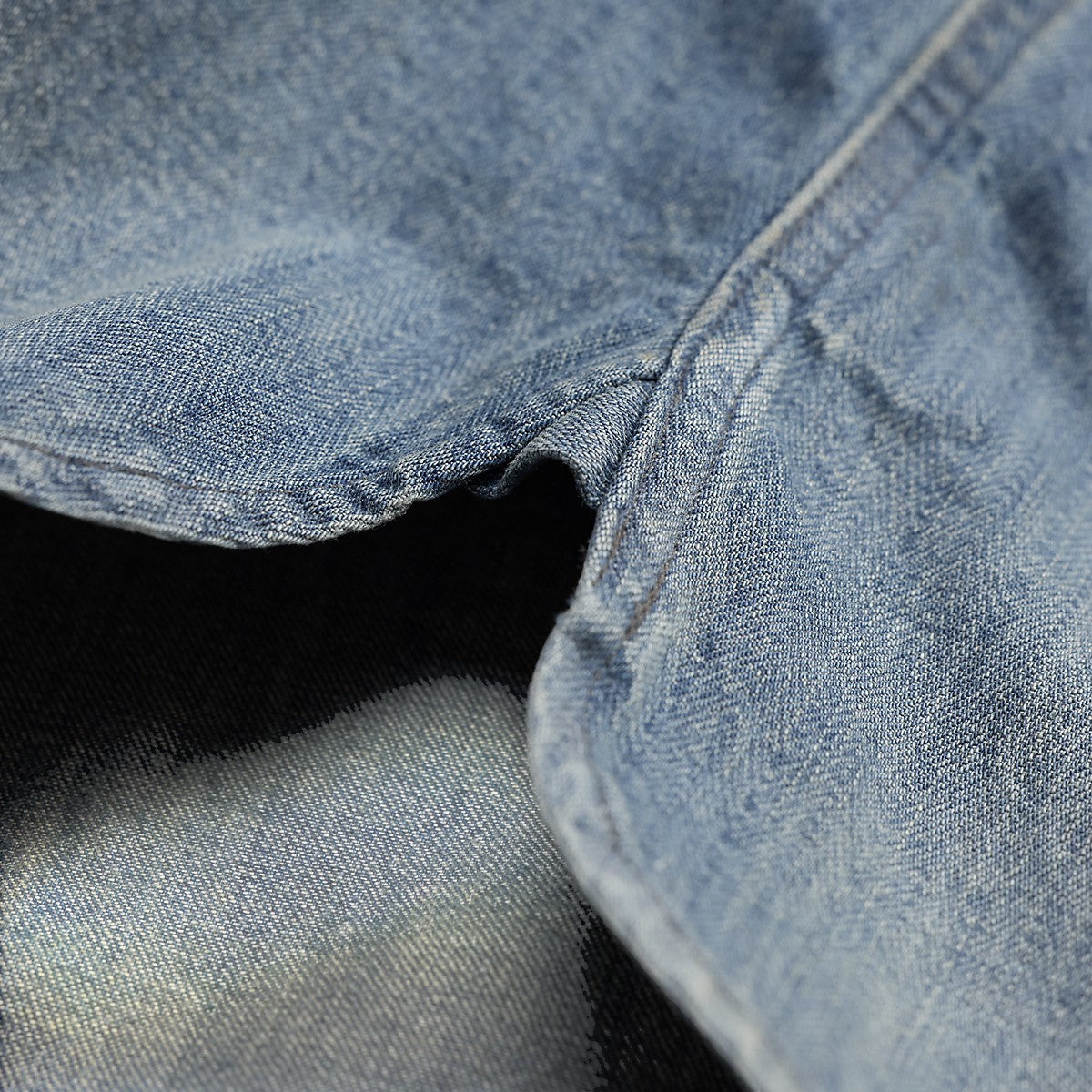 RRL indigo cotton denim workshirt fabric detail showing herringbone texture and distressed wash
