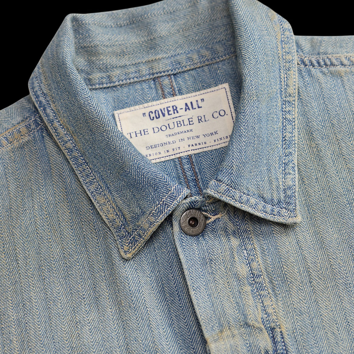 RRL distressed indigo herringbone cotton coverall collar with Double RL & Co. label and metal button detail