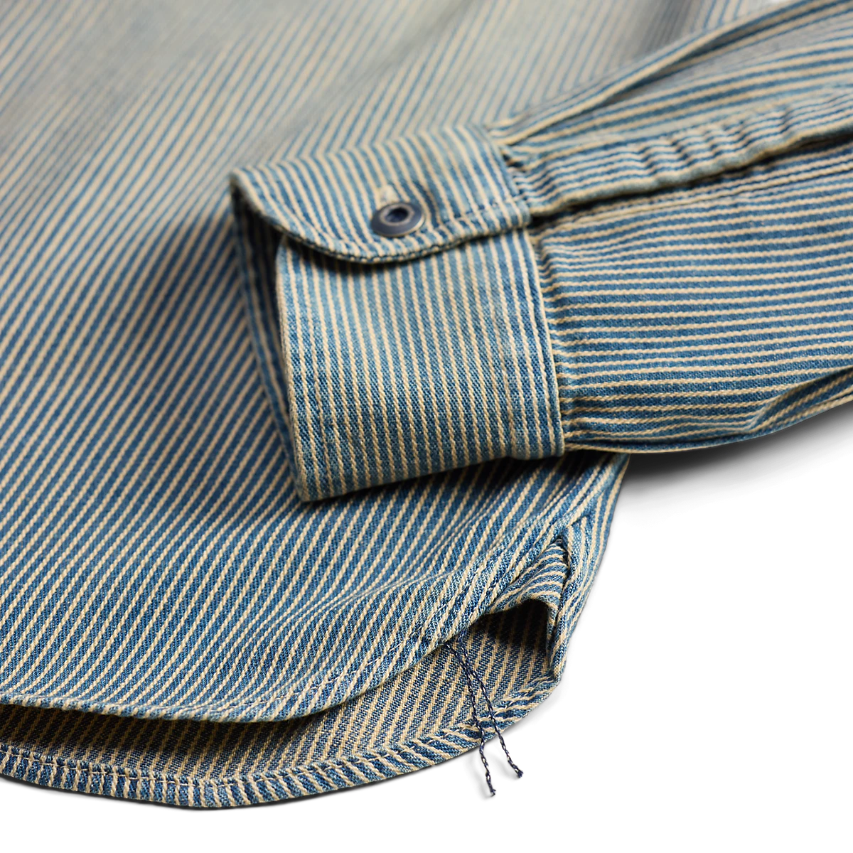 Double RL indigo striped twill workshirt sleeve cuff with distressed metal button and authentic chain-stitch runoff