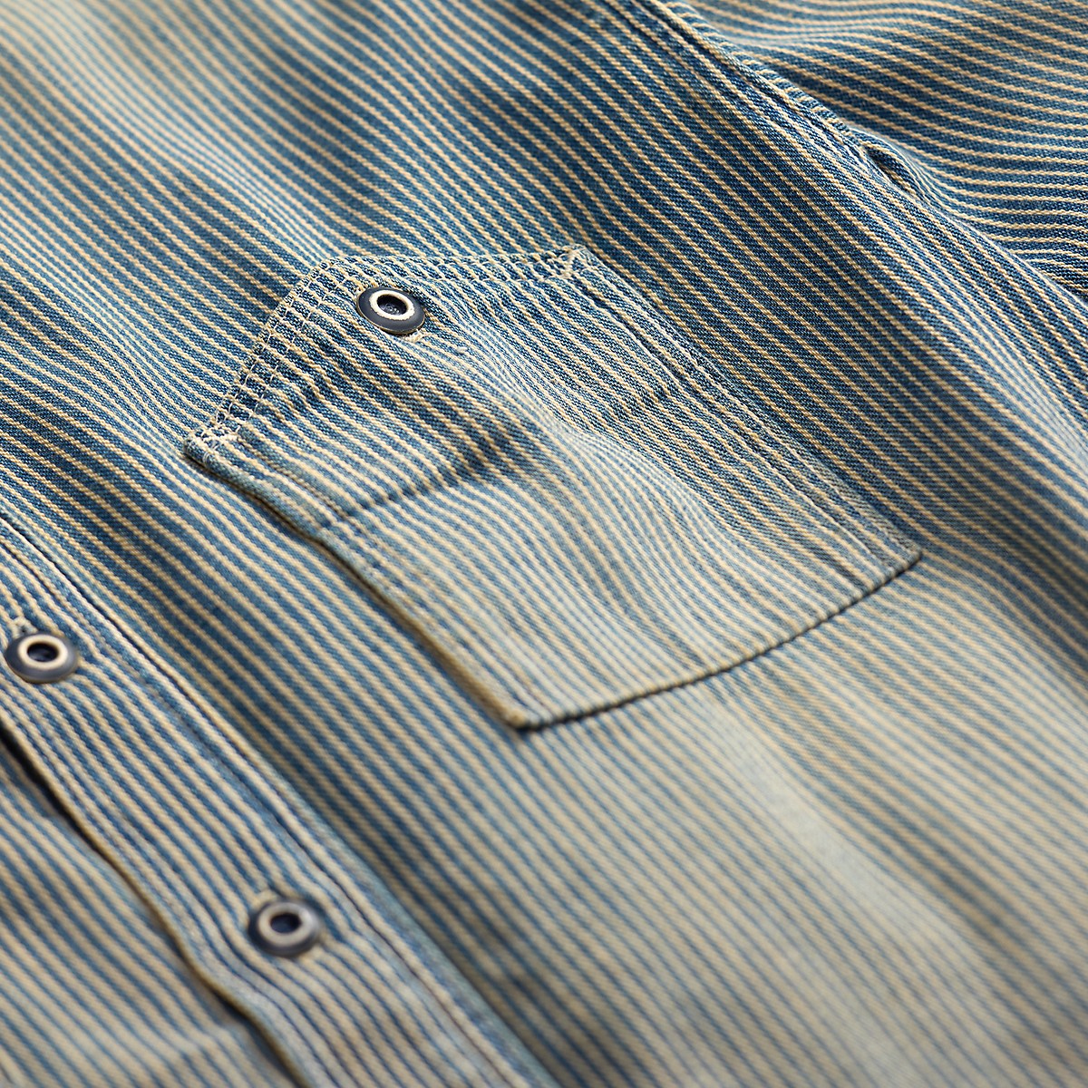 Double RL indigo striped twill workshirt featuring a chest pocket and distressed metal buttons in a faded blue finish.