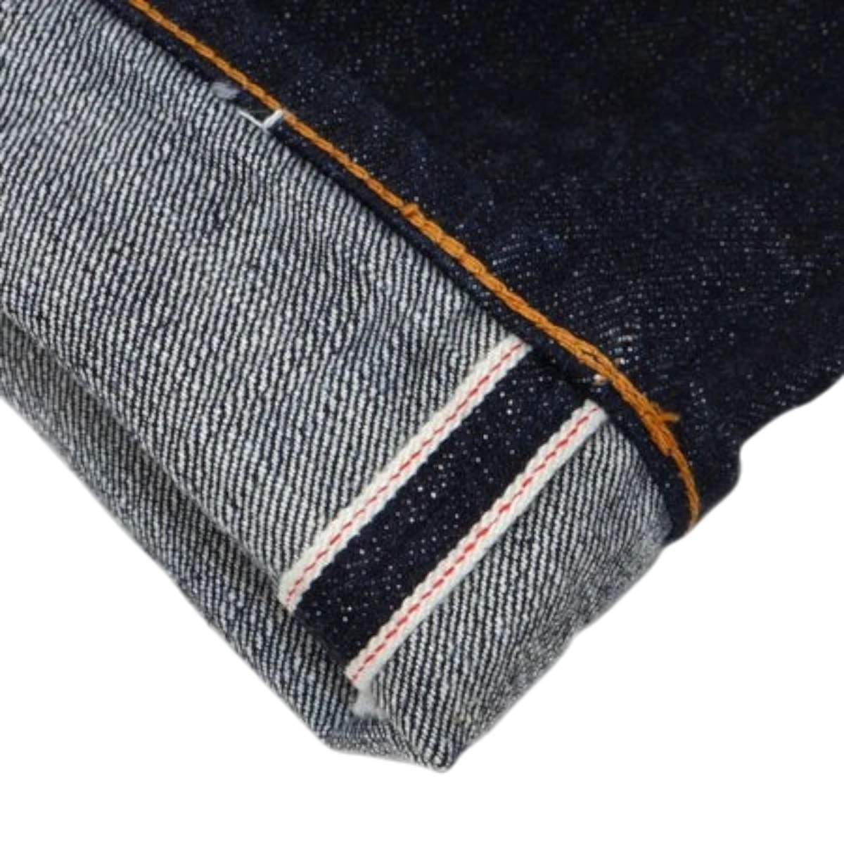 UES 17oz raw selvedge denim jeans cuff showing deep indigo fabric with signature red line selvedge detail