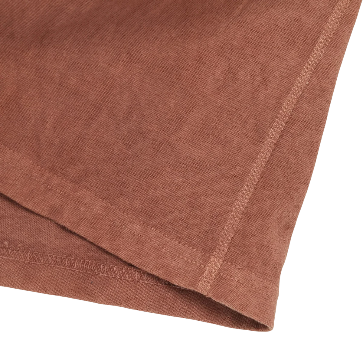 Wonder looper Amami hand-dyed recycled cotton T-shirt in a rosy brown shade with visible slubby texture and flat seams.
