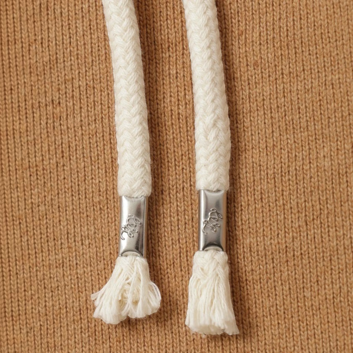 MILWORKS Foxfibre Coyote 80 heavyweight French terry hoodie drawstring detail with silver aglets on brown cotton fabric