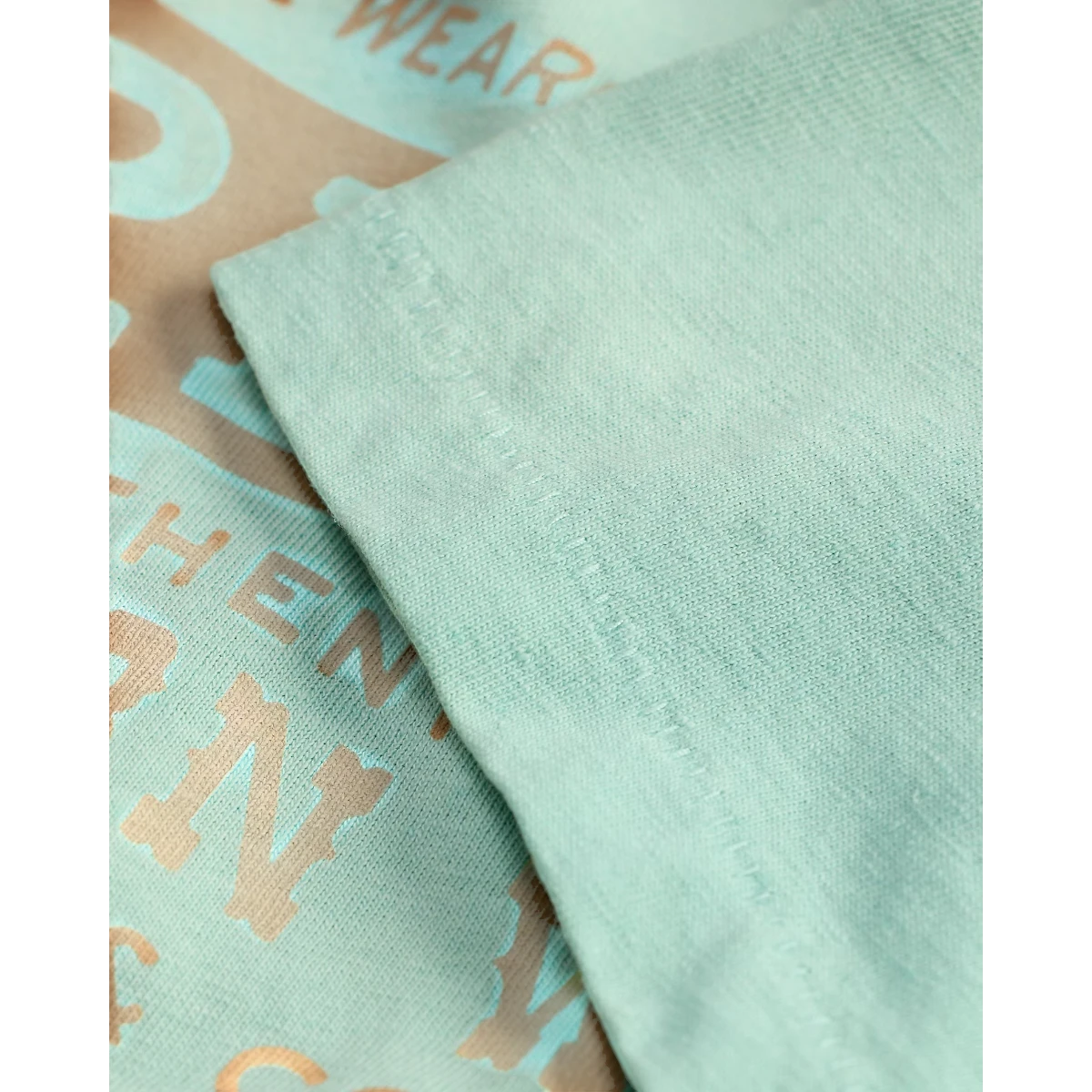 MILWORK faded turquoise cotton-hemp t-shirt with vintage graphic print and crewneck.