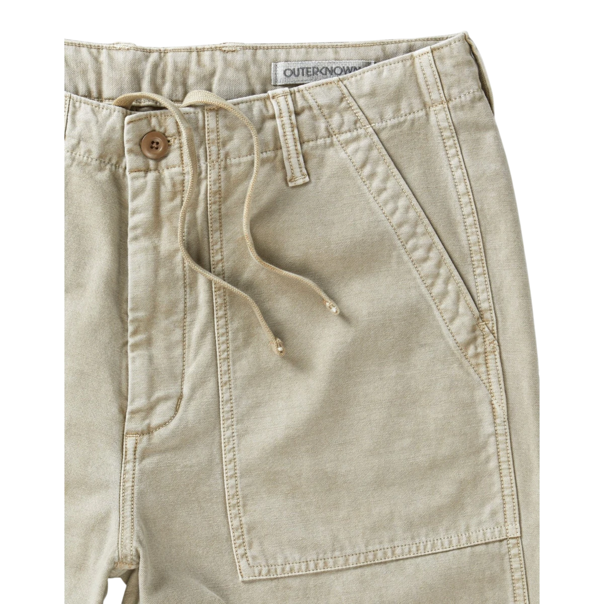 MILWORK Field Pant Desert in tan 100% Regenerative Organic Cotton. Utilitarian style with patch pockets, button flap back pockets, and drawstring waist.