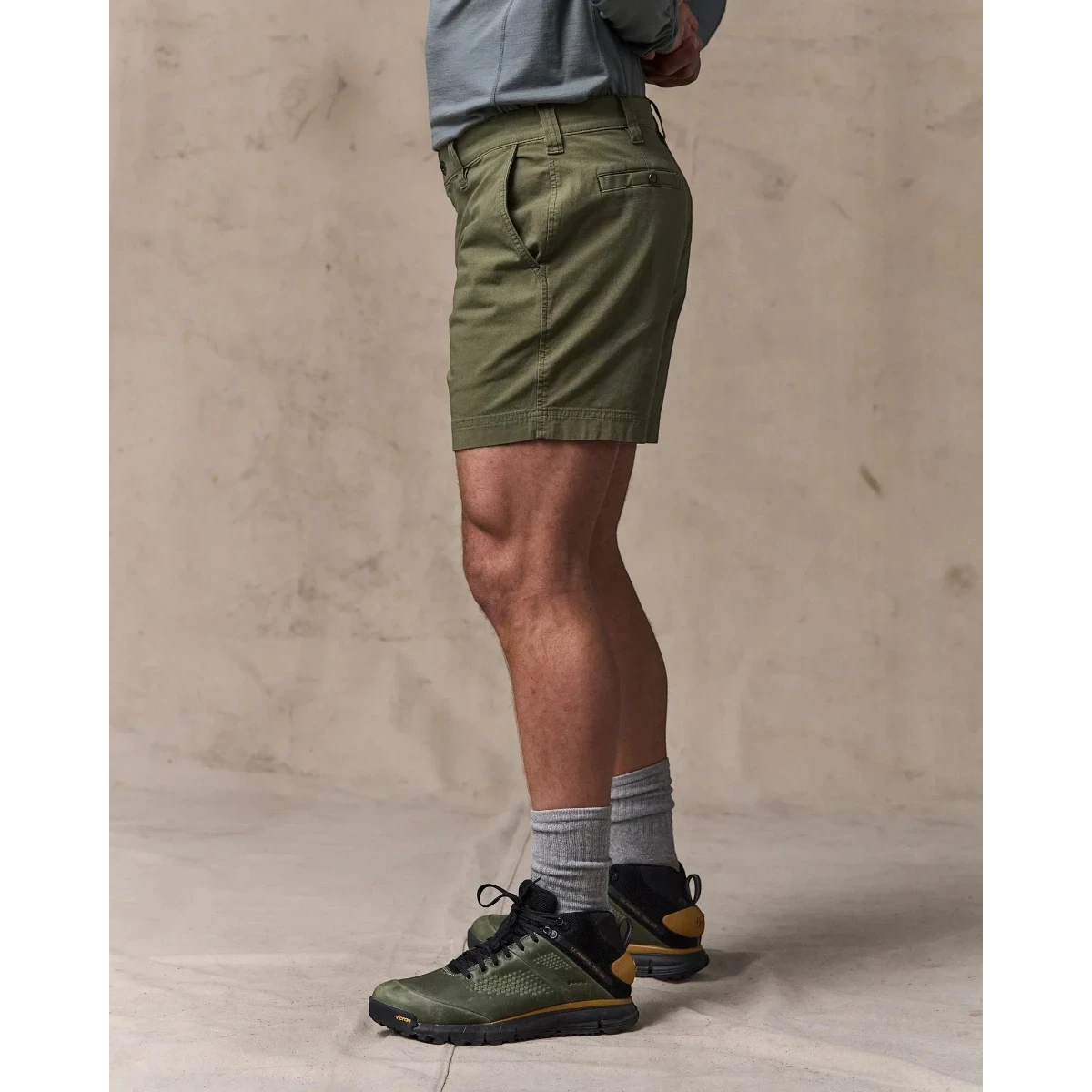 MILWORK Granite Mountain 6" shorts in burnt olive green cotton blend with zippered fly and metal button closure.
