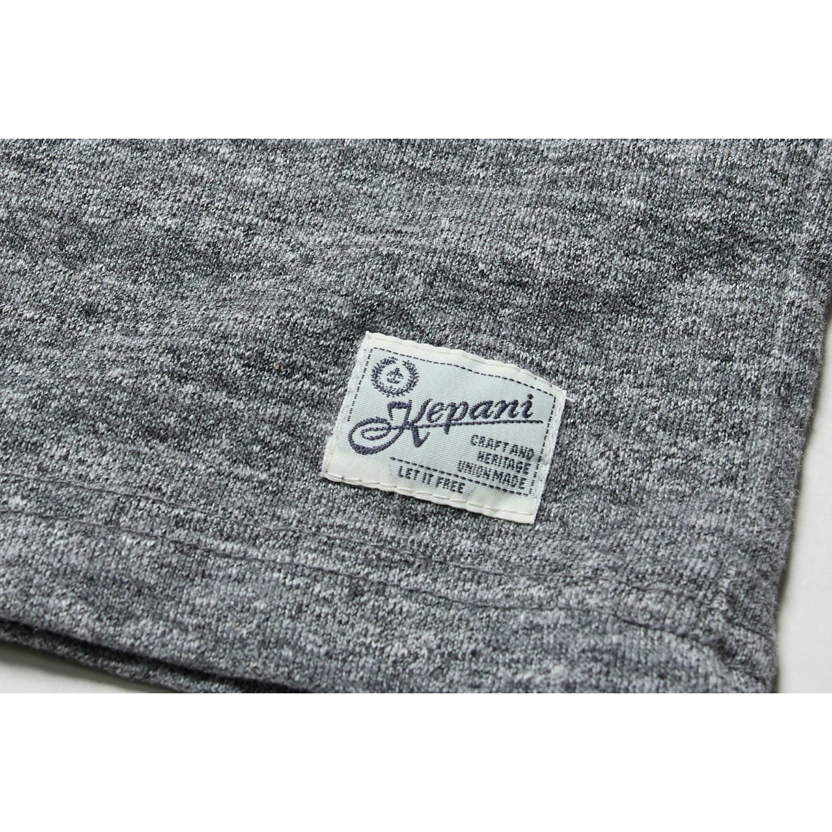 MILWORK Raffy grey marled cotton-poly blend knit tee with a woven label. Highly elastic fabric, made in Japan.