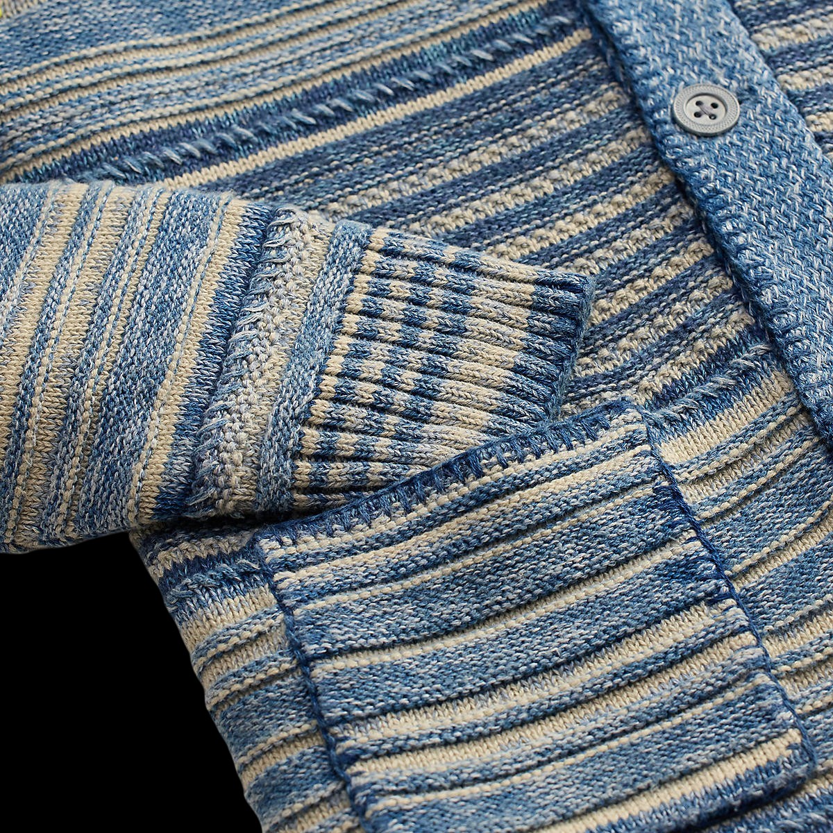 MILWORK Indigo Multi striped long sleeve sweater cardigan with button closure and ribbed cuffs.