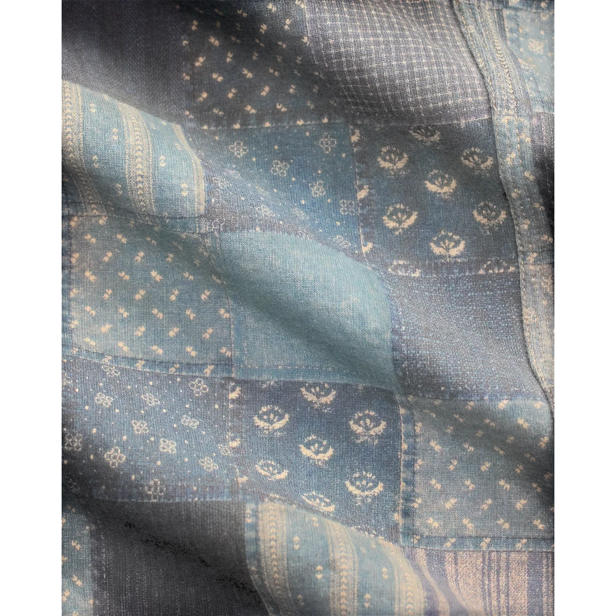 MILWORK Navy Multi patchwork print cotton jersey work jacket with faded wash and metal buttons.