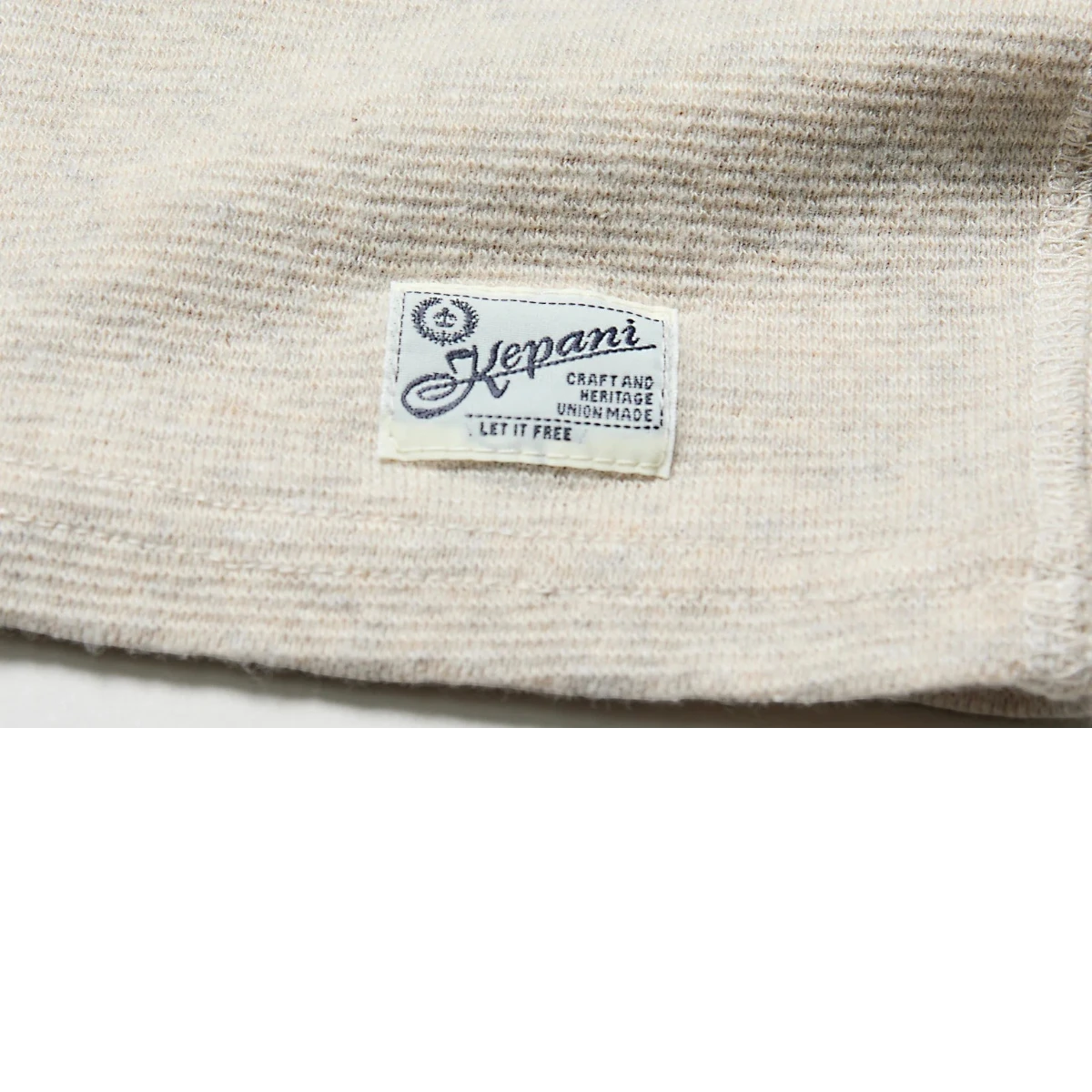 MILWORK Raffy Span Rib Knit Tee in oatmeal. Highly elastic cotton-poly blend fabric with horizontal ribbing. Made in Japan.