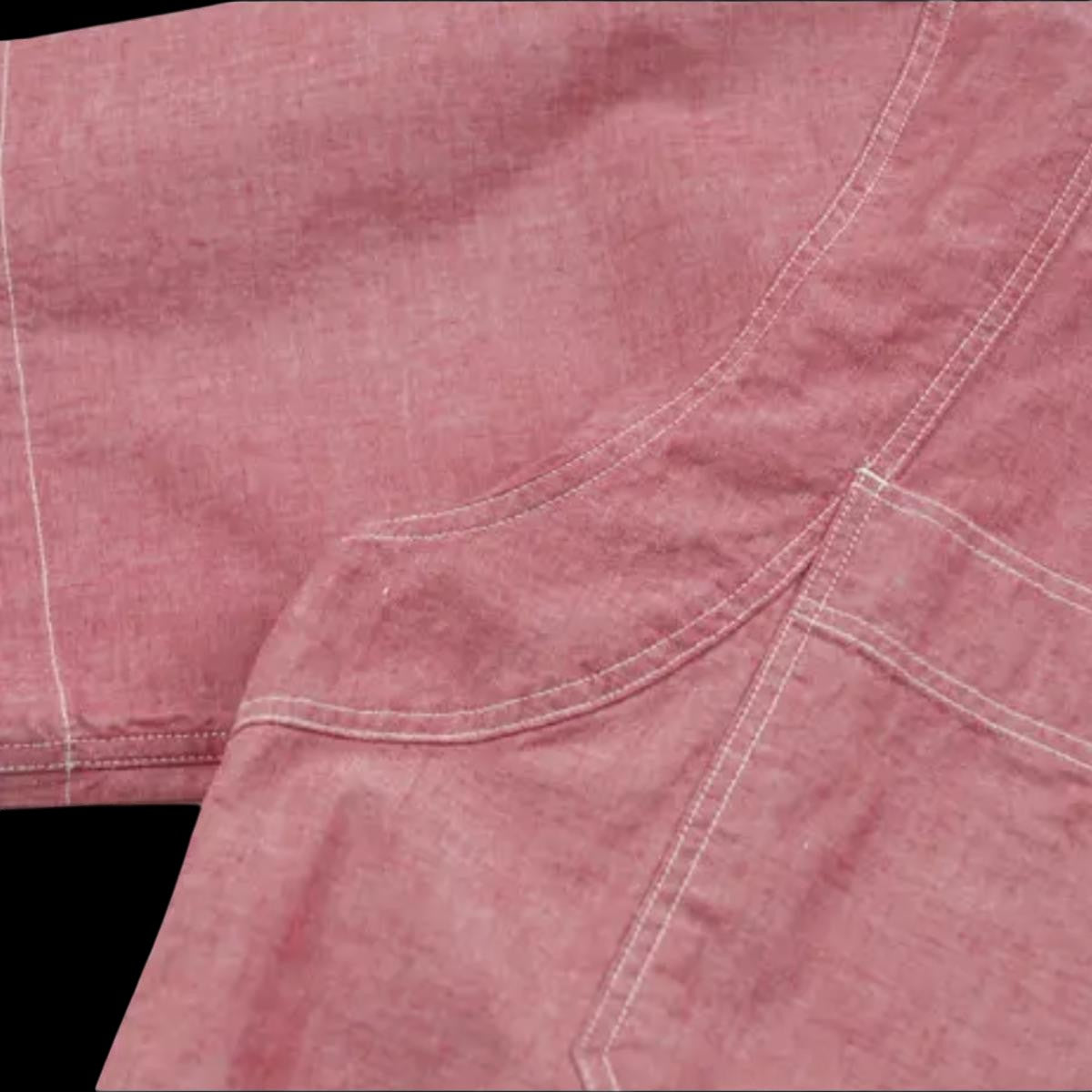 MILWORK Red cotton chambray work shirt with dual chest pockets and reinforced stitching. Relaxed fit.