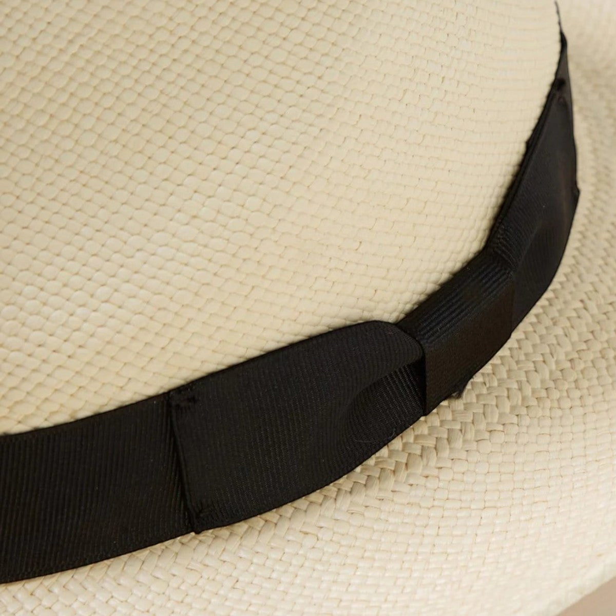MILWORK Retro Panama Fedora hat in natural toquilla straw with a black grosgrain band. Handwoven, 4 1/2" crown, 2 1/2" brim.