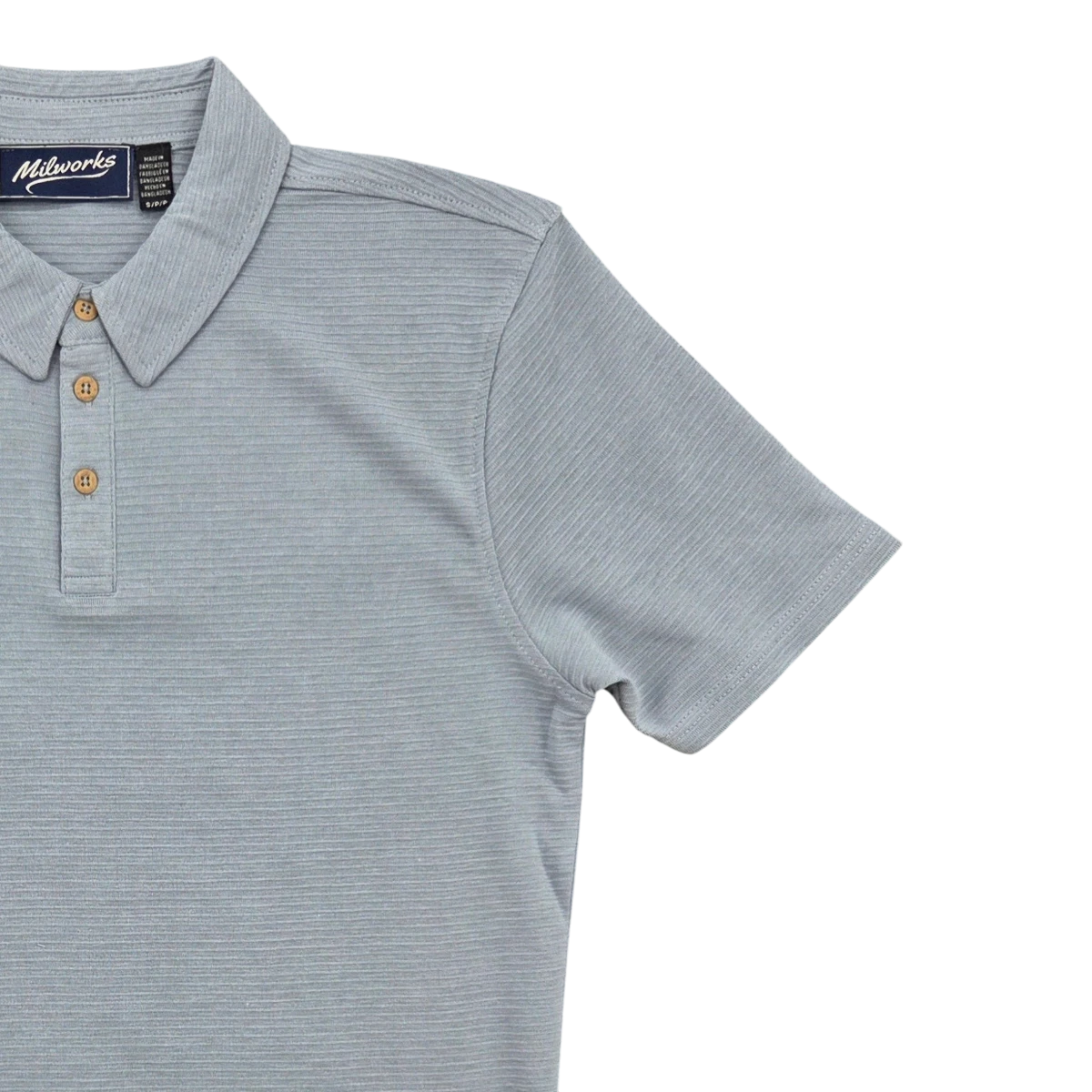 MILWORK Short Sleeve Polo in light blue melange with textured fabric and two button placket.