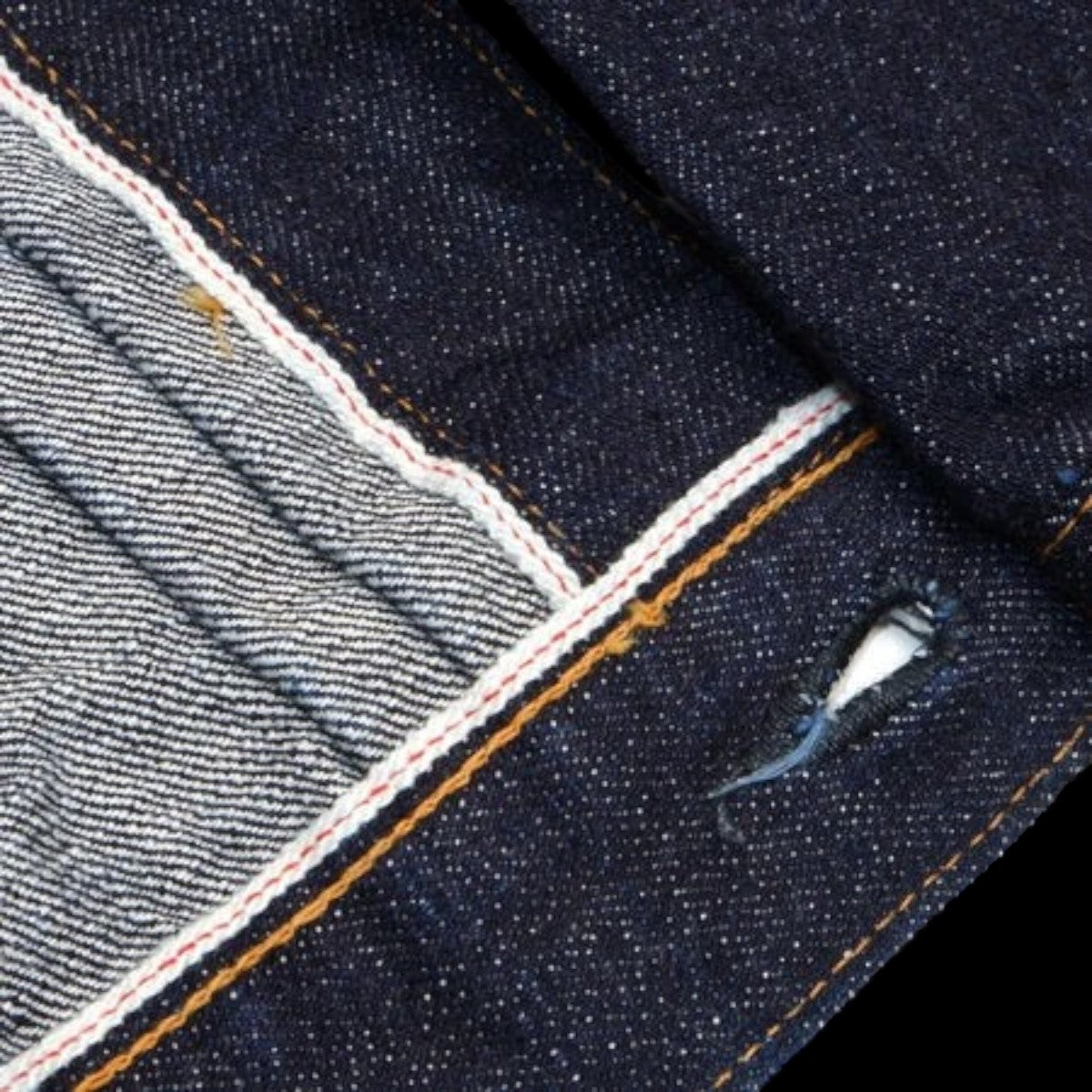 MILWORKS 17oz denim jacket showing red selvedge detail on the front facing and cuff, made in Japan from 100% cotton.