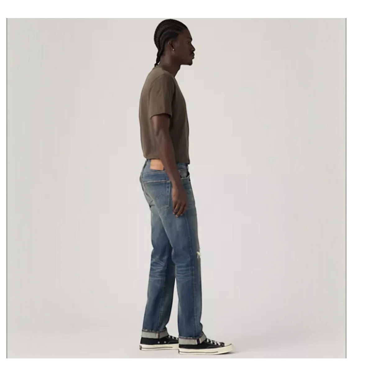 MILWORKS model wearing 501 Original Nevada Farmers Selvedge jeans with a straight leg fit and worn wash finish