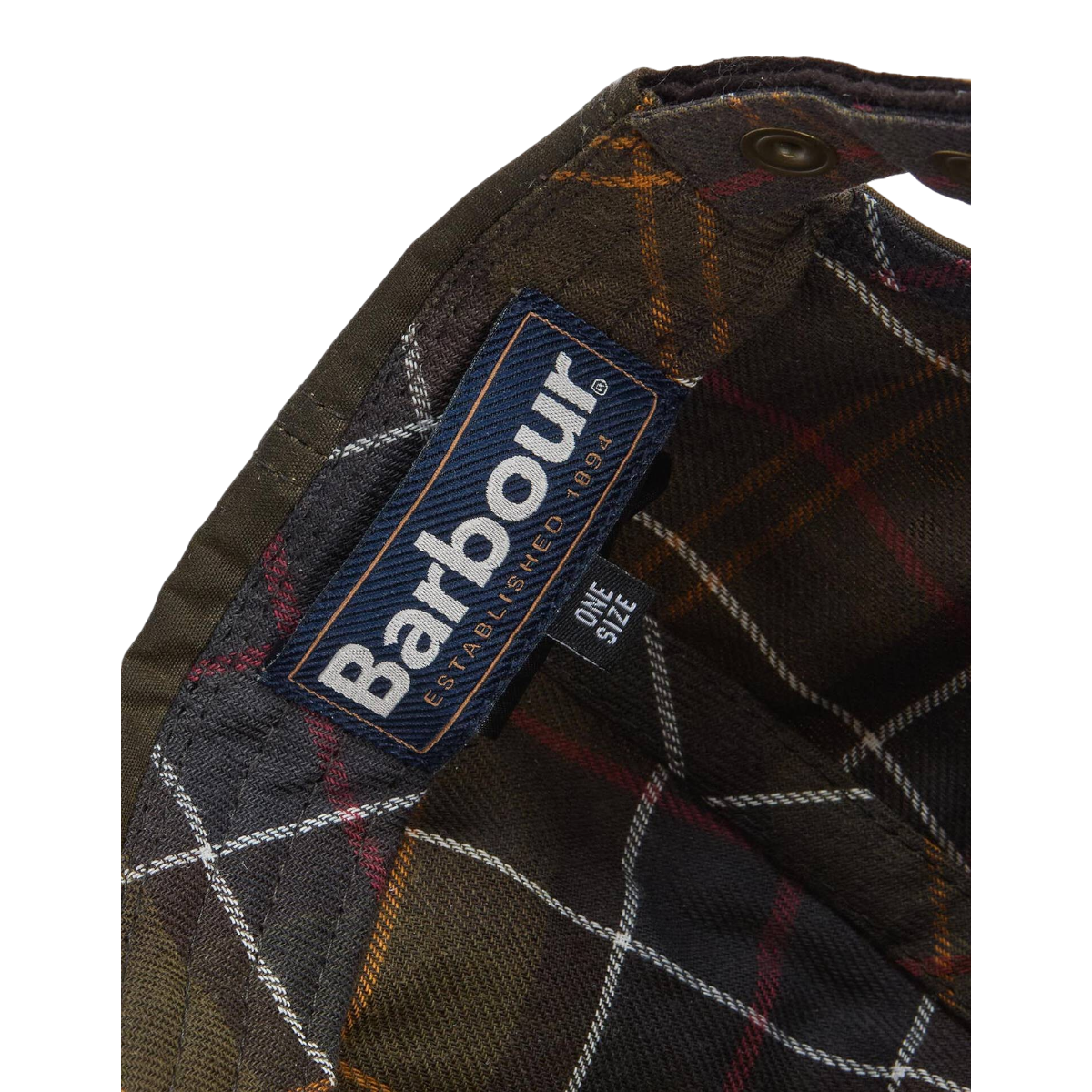 MILWORKS Barbour Ashby cap interior showing tartan lining, Barbour brand label, and olive waxed cotton construction.