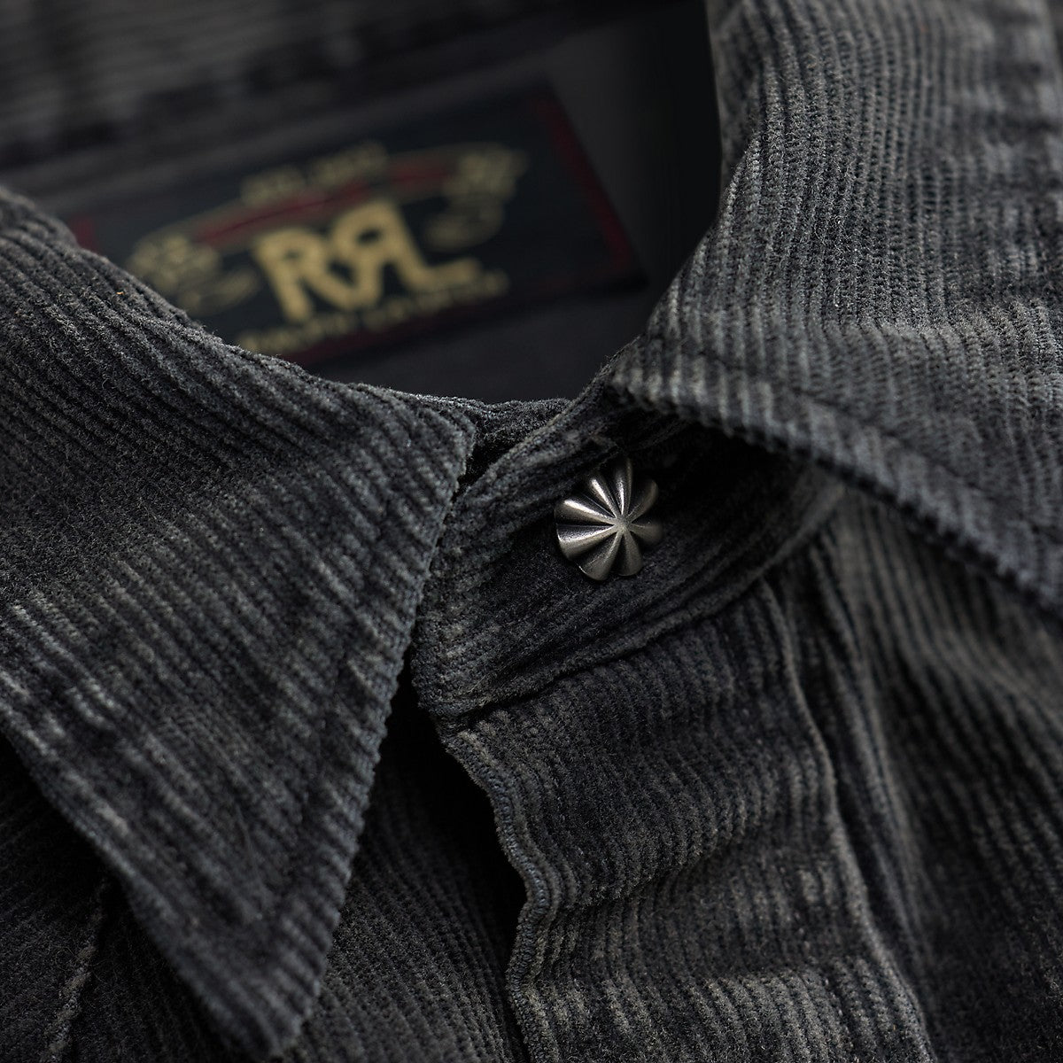 RRL black cotton corduroy Western shirt featuring a vintage-inspired metal collar button and textured fabric.