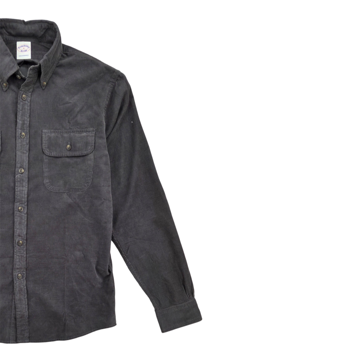 MILWORKS black micro corduroy workshirt with button-down collar, long sleeves, and a single chest pocket.