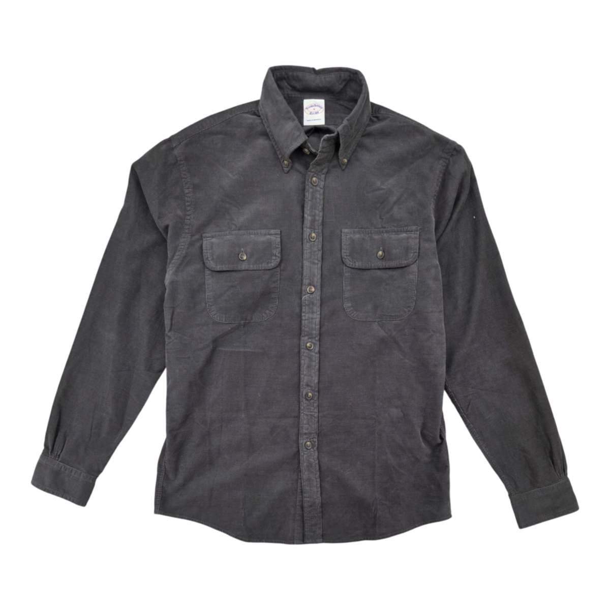 MILWORKS black micro corduroy long-sleeve workshirt with button-down collar and dual chest pockets.