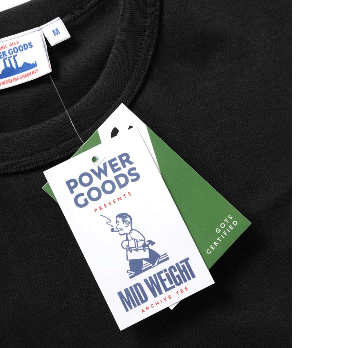 MILWORKS 7.5oz Archive Tee in black organic cotton with a vintage neckline and GOTS certified branding tag.