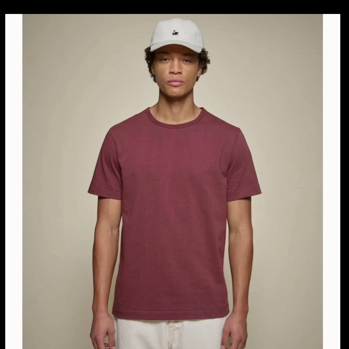 MILWORKS model wearing a burgundy 2M15 sturdy organic cotton crew-neck t-shirt with baseball stitching