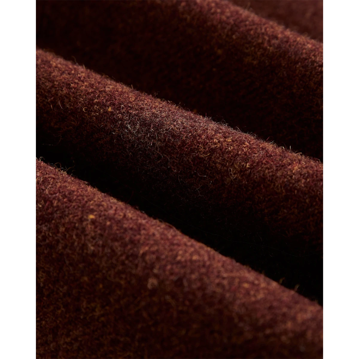 Close-up of the deep burgundy wool fabric texture of a MILWORKS Sport Jacket Double Breast Terroir