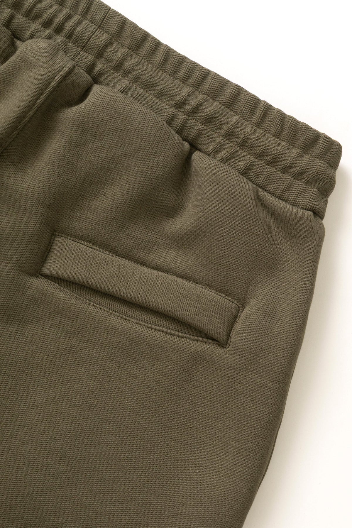 MILWORKS dark olive 16oz organic cotton heavyweight sweatpants featuring an elastic waistband and back pocket detail.