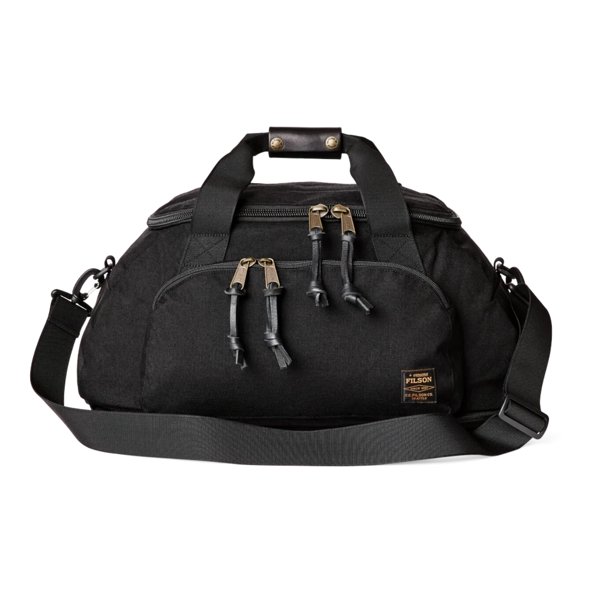 MILWORKS Dryden Duffle Pack in black 1000D nylon with bridle leather grip, U-shaped zipper, and shoulder strap.