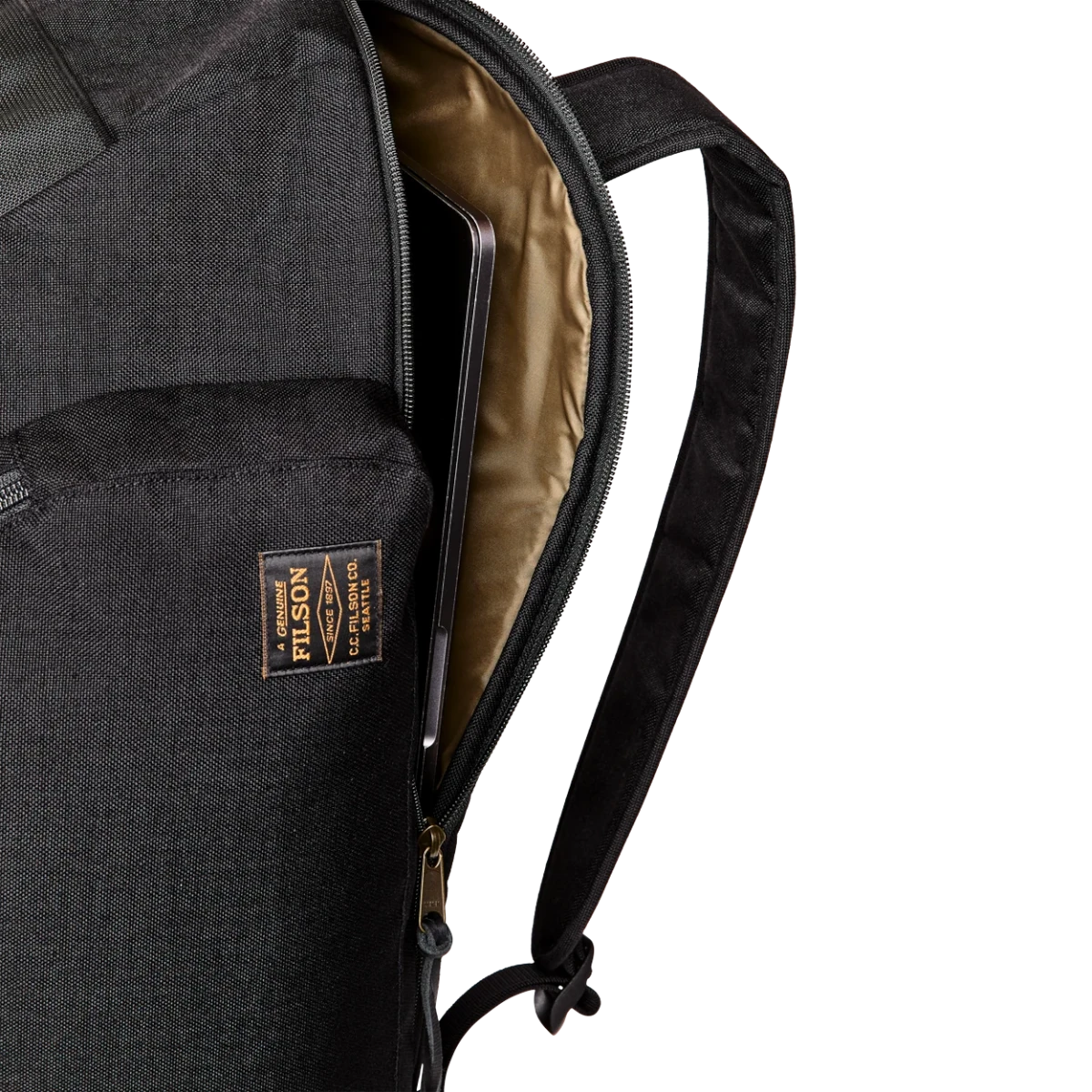 MILWORKS Dryden Duffle Pack in black nylon showing the padded laptop compartment with a laptop inside.