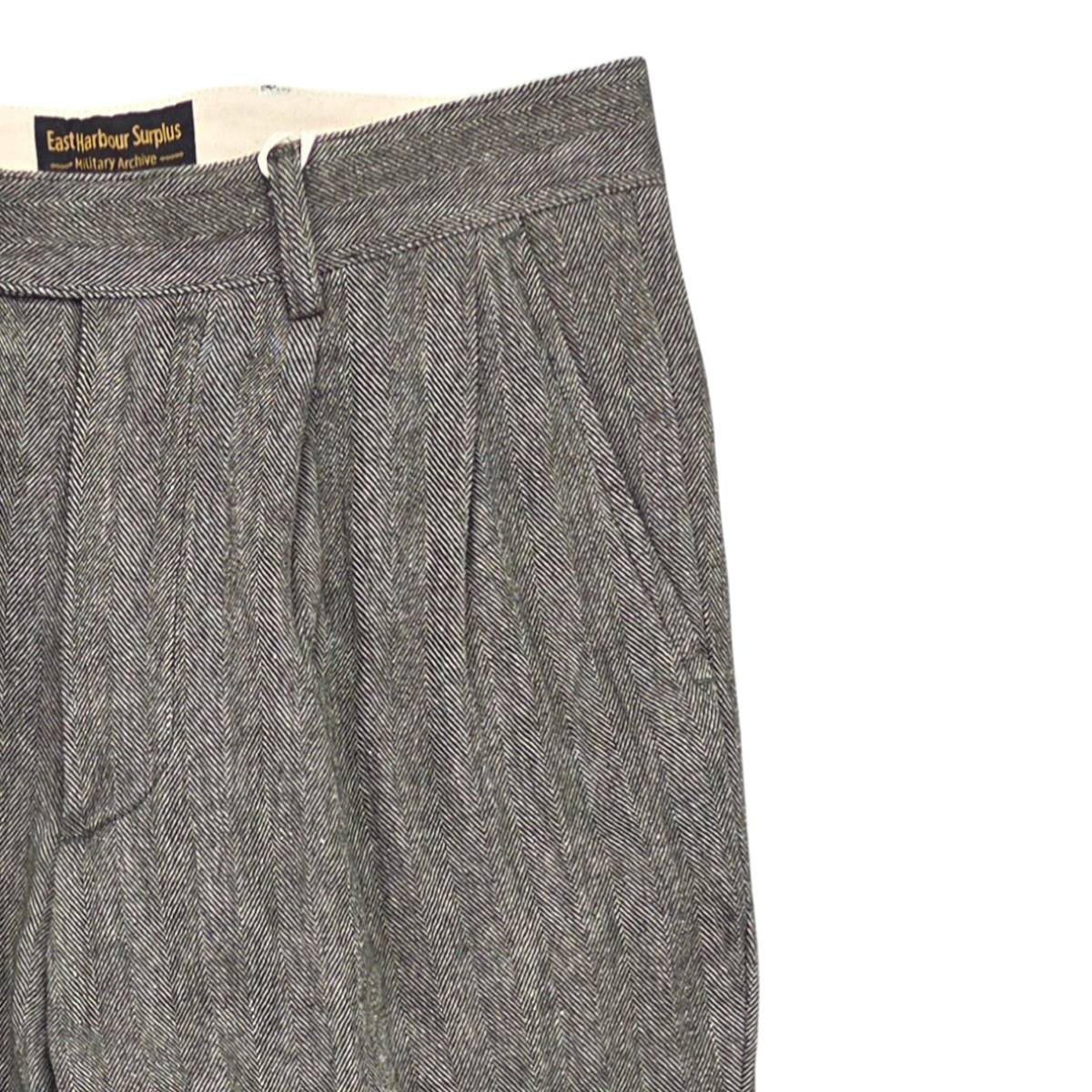 MILWORKS East Harbour Surplus grey herringbone double pleated pants with a tailored waistband and side pockets.