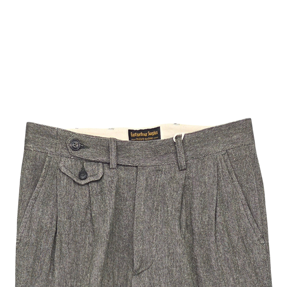 MILWORKS East Harbour Surplus grey double pleated trousers featuring a herringbone pattern and buttoned coin pocket.