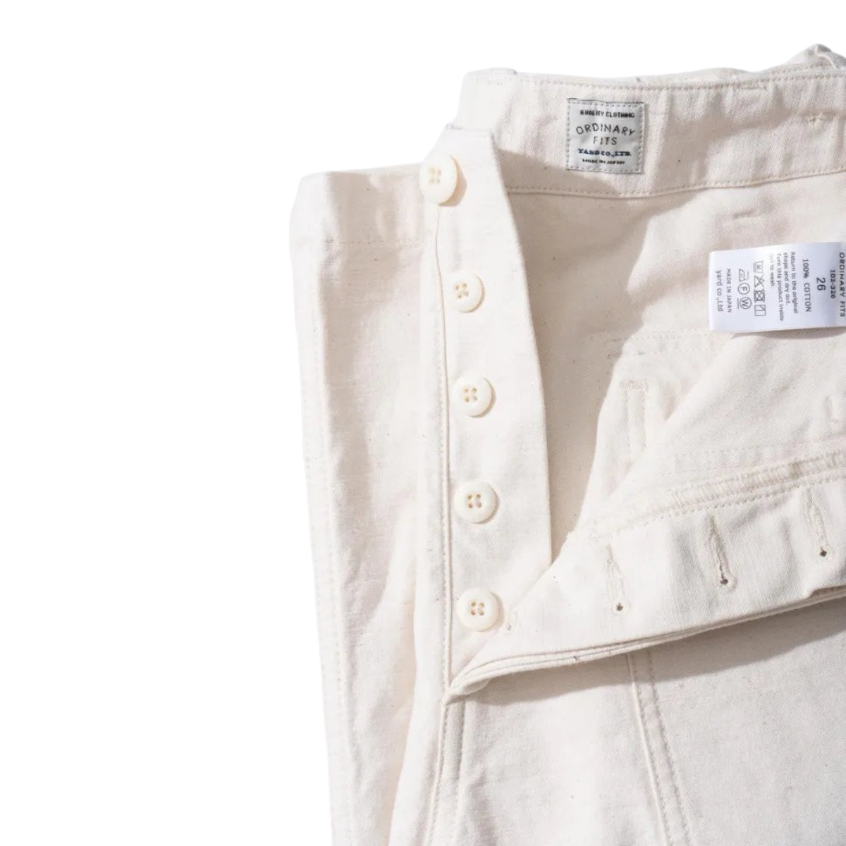 MILWORKS vintage fatigue pants in ecru back sateen fabric featuring a button fly and Japanese-made construction.