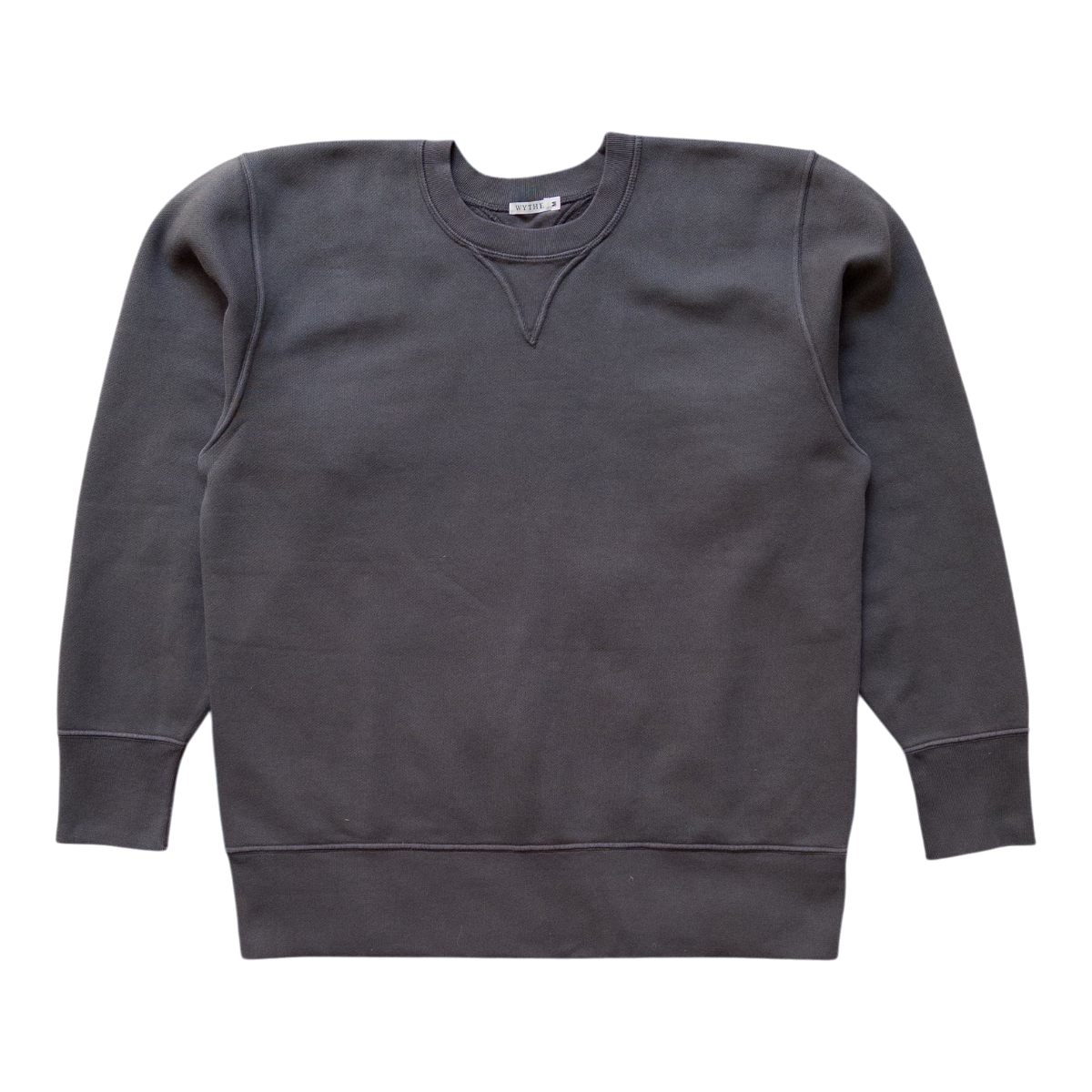 MILWORKS faded black cotton crewneck sweatshirt with a vintage-inspired V-insert neckline and ribbed cuffs and hem.