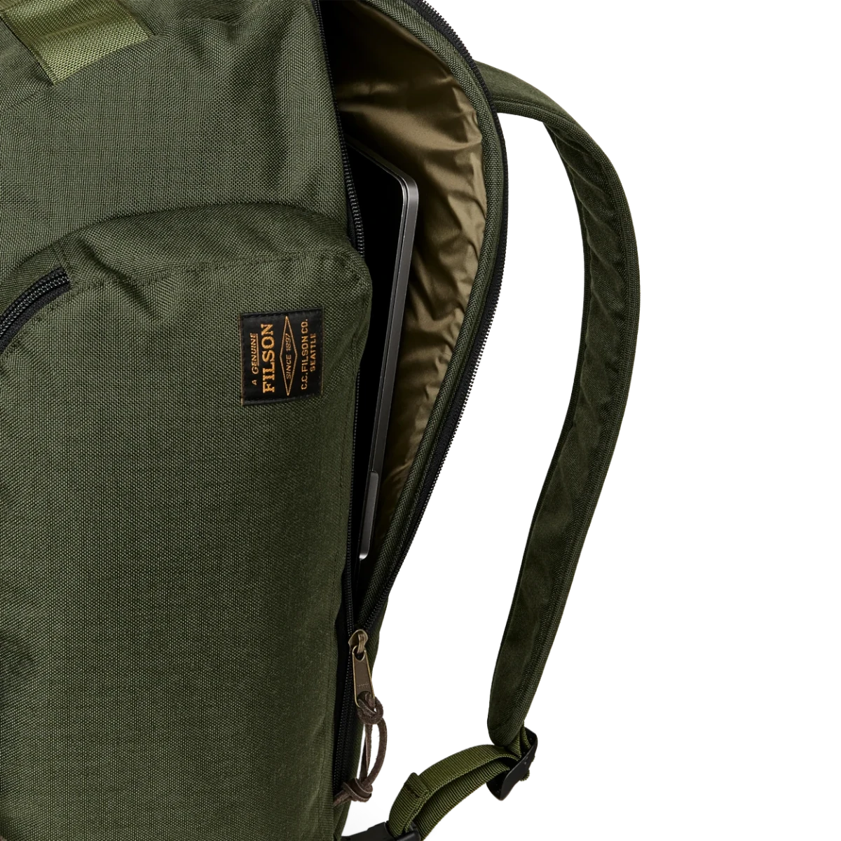 MILWORKS Filson Dryden Duffle Pack in otter green nylon with a side-access padded laptop compartment.