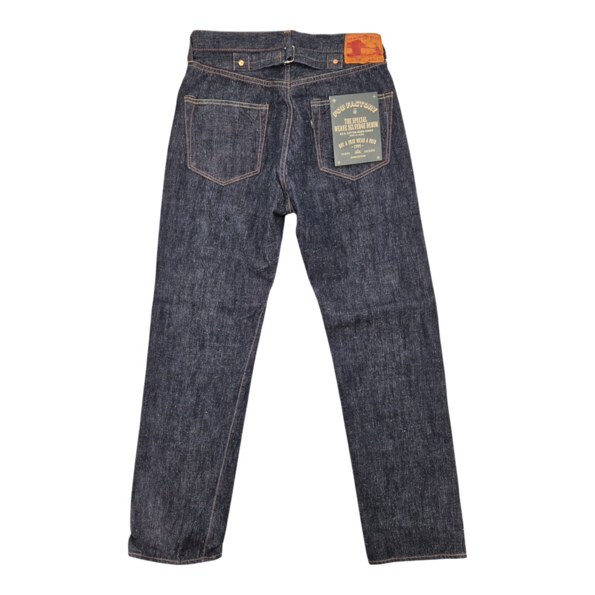 MILWORKS F.O.B Factory selvedge denim overalls in dark rinse with buckle back and leather patch, back view.