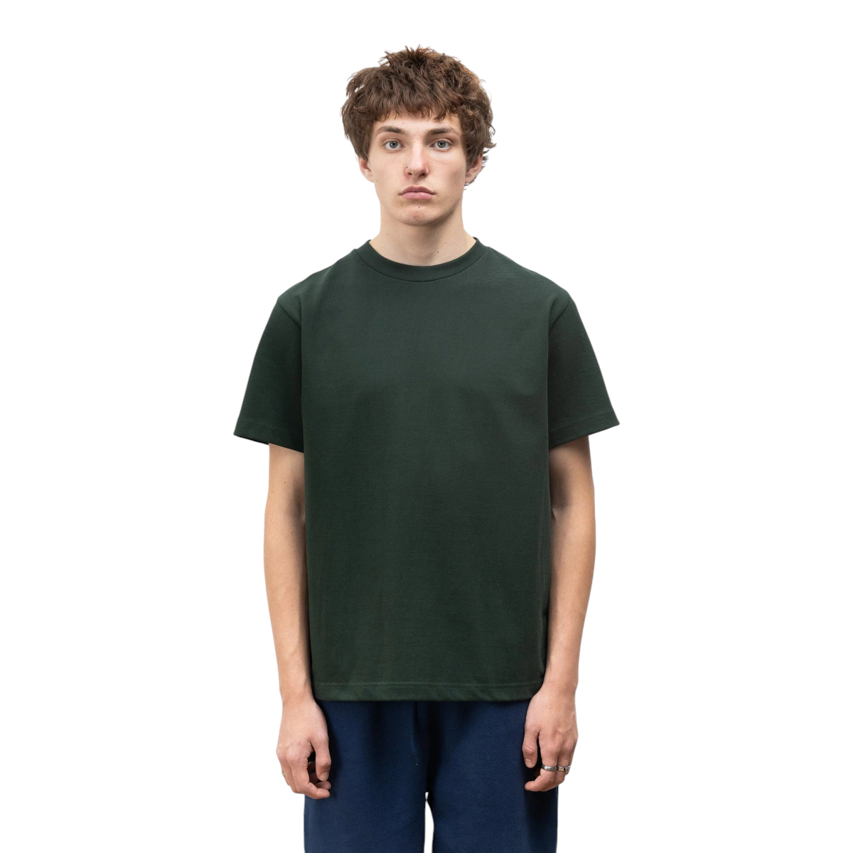 MILWORKS model wearing a forest green 10oz organic cotton heavyweight t-shirt with a reinforced ribbed neckline.