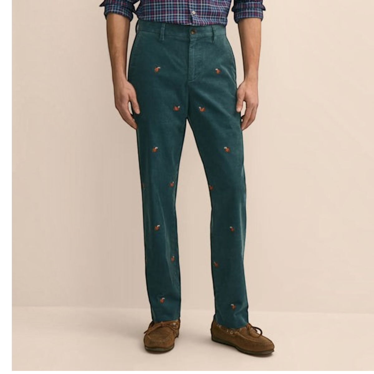 MILWORKS dark green cotton corduroy pants featuring an embroidered squirrel motif and a classic flat front silhouette.