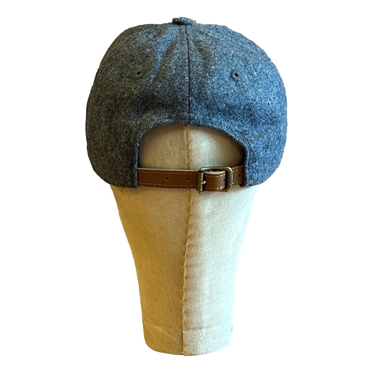MILWORKS grey wool blend baseball cap with adjustable leather strap and metal clasp.