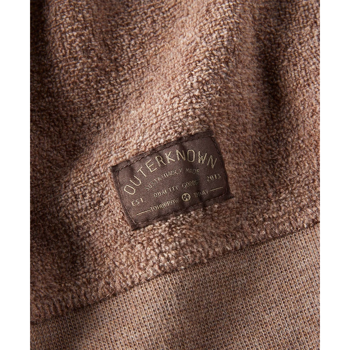 MILWORKS Hightide Crew sweatshirt in heather coconut brown, featuring a textured knit and a woven brand label.