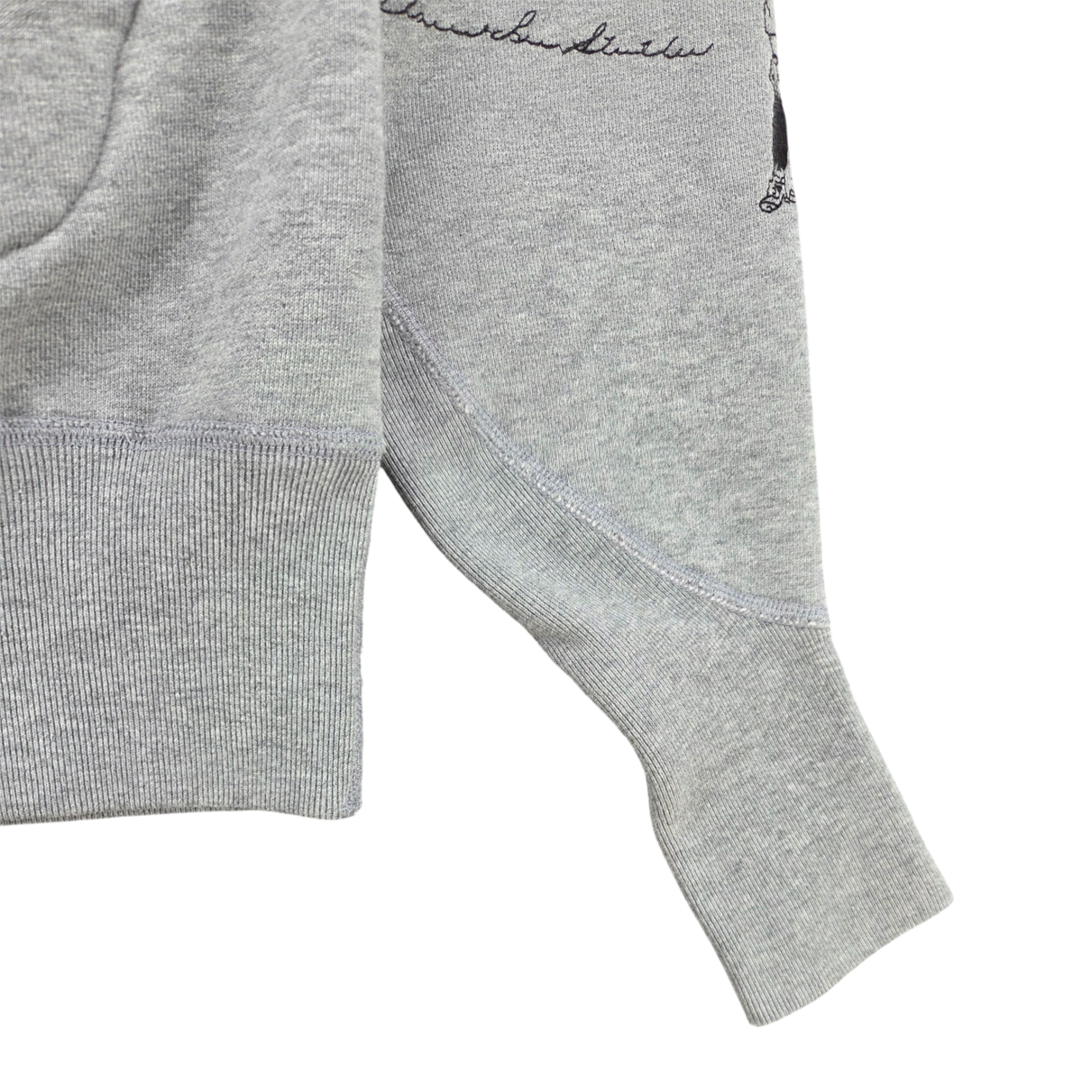 MILWORKS heather grey varsity hoodie featuring ribbed cuffs and detailed multicolor embroidery on the sleeve