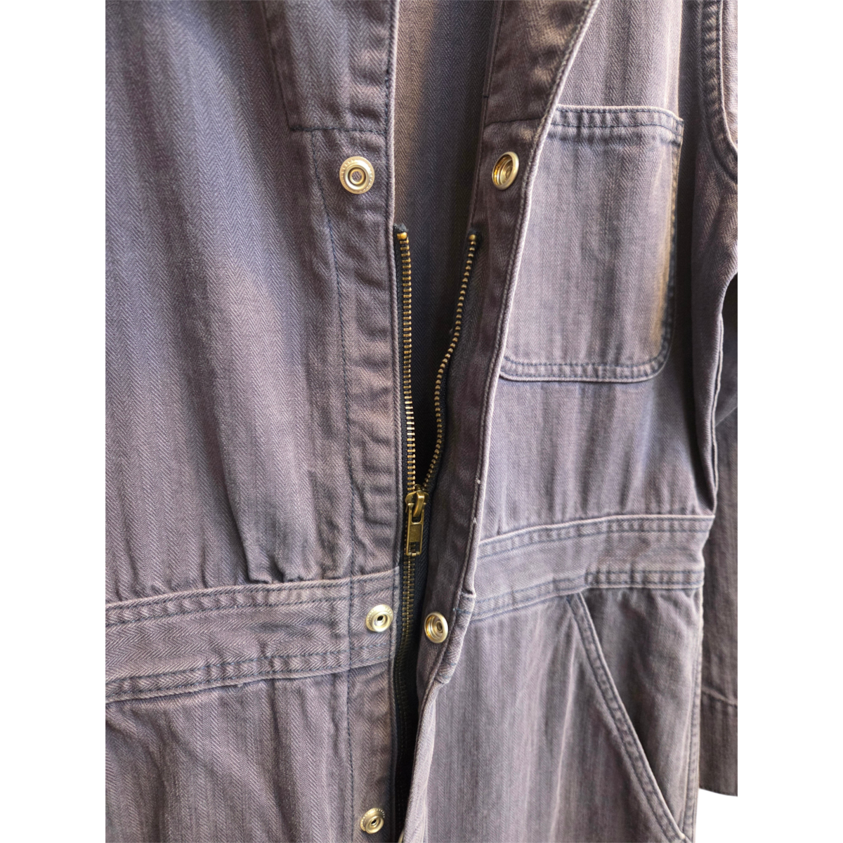 MILWORKS mechanic coverall in deep blue Japanese herringbone twill with a front zip and concealed snap buttons