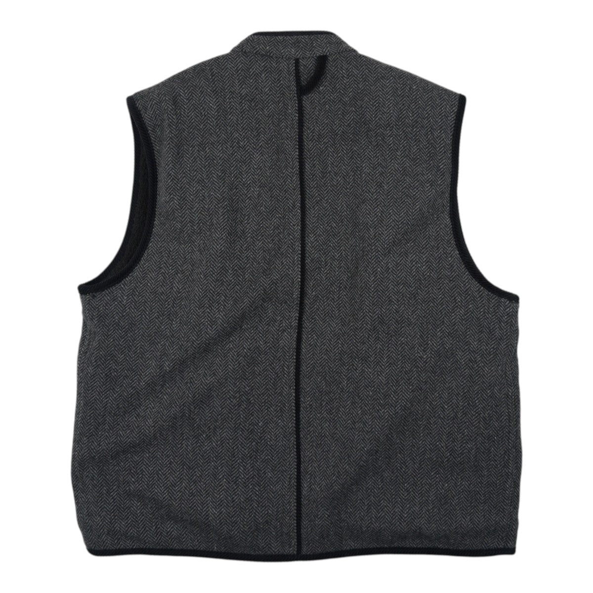 Back view of a MILWORKS chestnut black herringbone wool hunting vest with black trim detailing.
