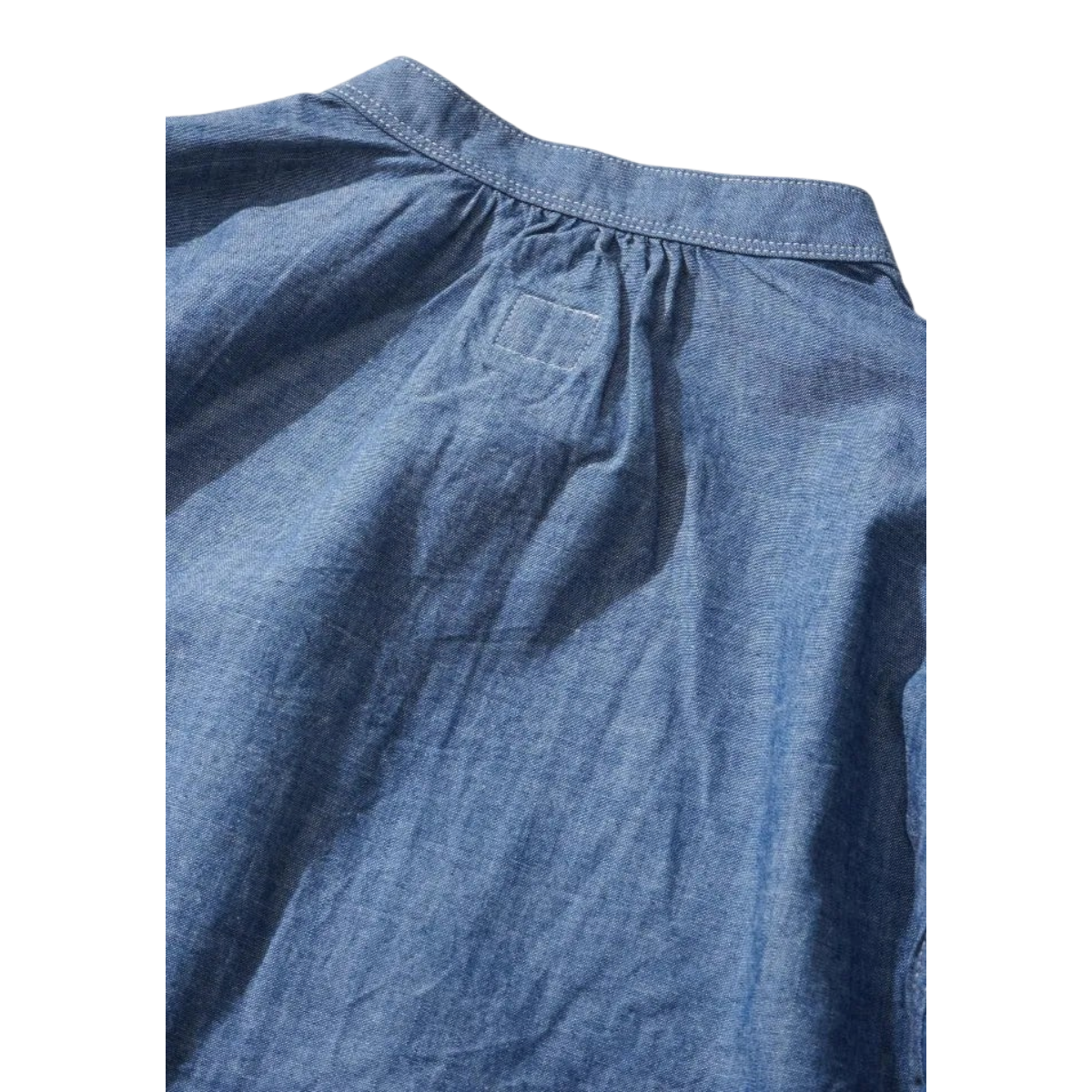 MILWORKS indigo chambray pullover work shirt featuring a gathered back yoke and durable cotton fabric construction.