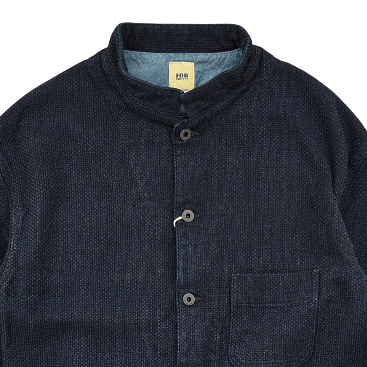 MILWORKS F.O.B Factory indigo sashiko jacket with a mandarin collar, button front, and textured cotton fabric.
