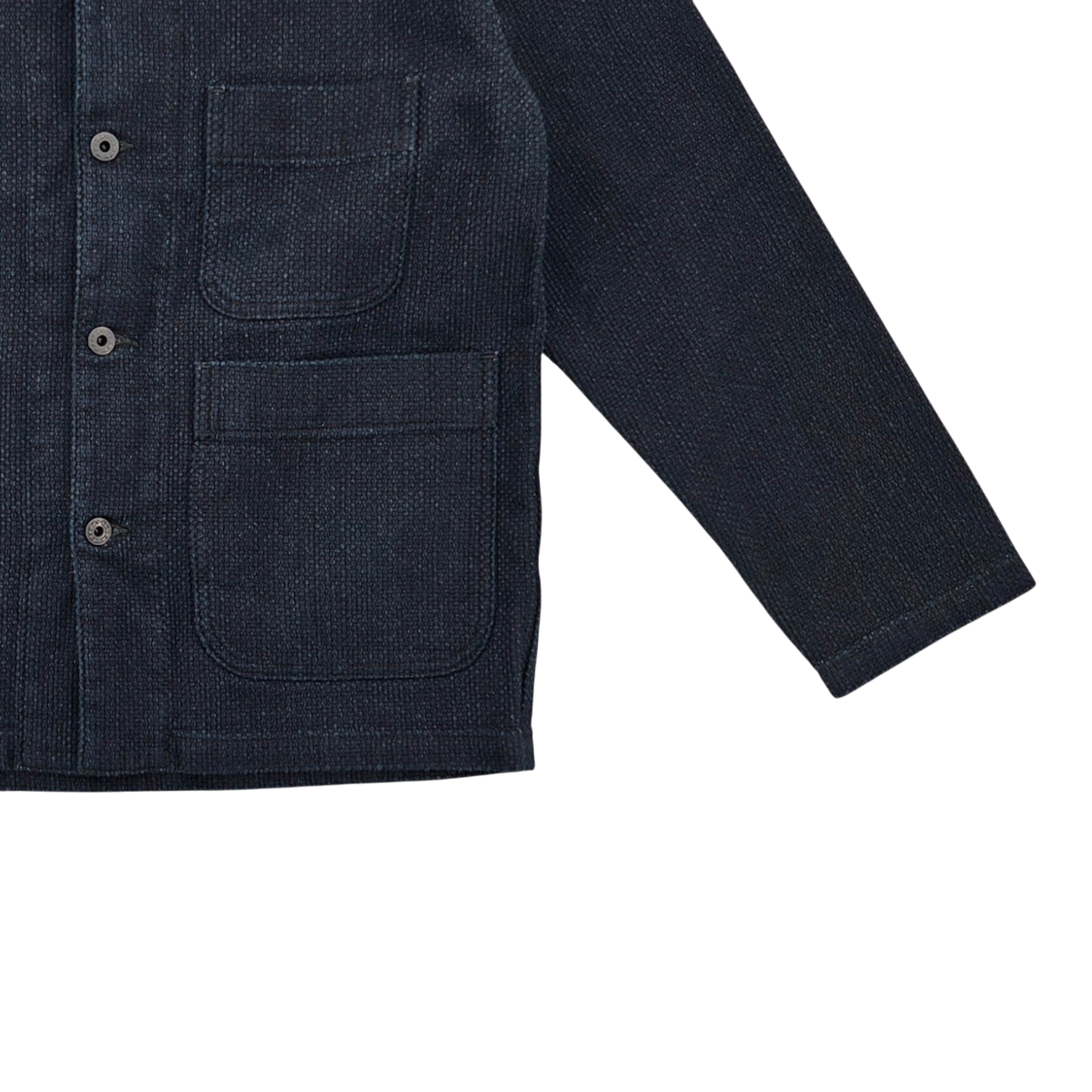 MILWORKS indigo sashiko jacket featuring textured fabric, button front, and two patch pockets in a workwear style.