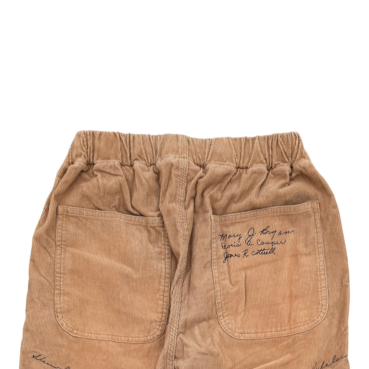 MILWORKS khaki corduroy pants featuring an elastic waistband and multicolor embroidered text on the back pocket.