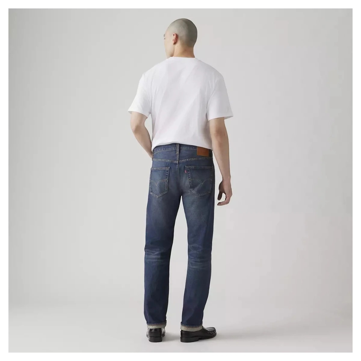 MILWORKS Levi's 501 Original selvedge jeans in dark wash Bounty Hunter denim worn by a man from the back view