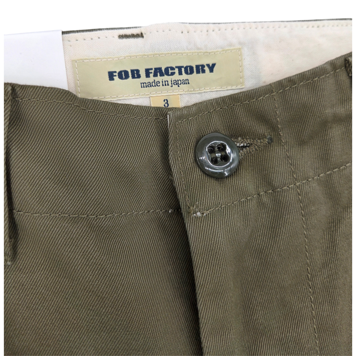 MILWORKS F0514 U.S Officer Chino in olive green cotton twill with button closure and FOB Factory interior label